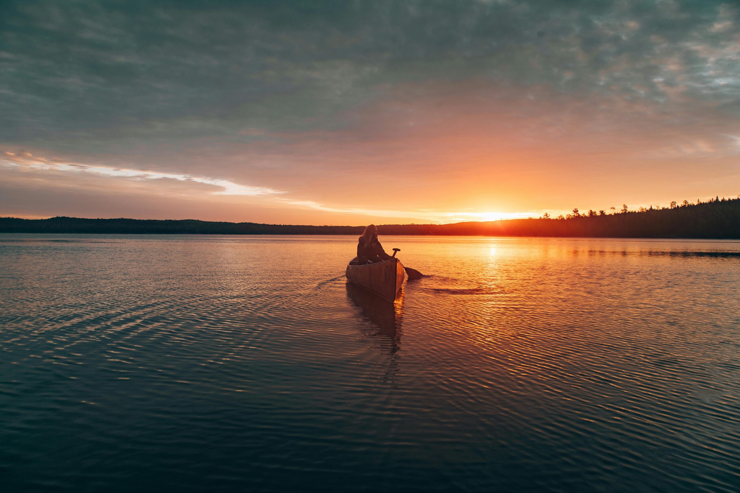 Person Riding Kayak